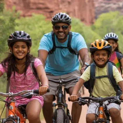 Family from India Cycle through national parks for outdoor adventures. Introducing cultural diversity in family travel