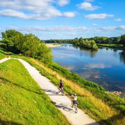 Chatilllon sur Loire, France - August 9, 2023: Cyclists ride on thefra cycle path along the Loire River in France.